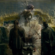 From left to right: The expedition team comes across a man’s body that’s been transformed by the Shimmer into a fungal growth and Amoongus, a fungus Pokémon.